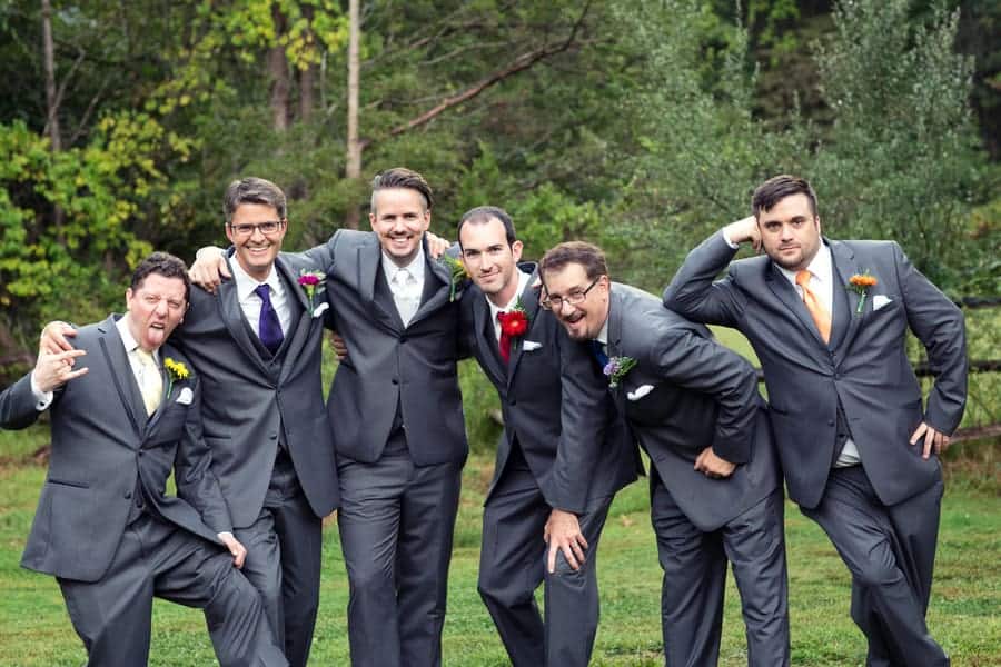 Groomsmen with colourful flowers