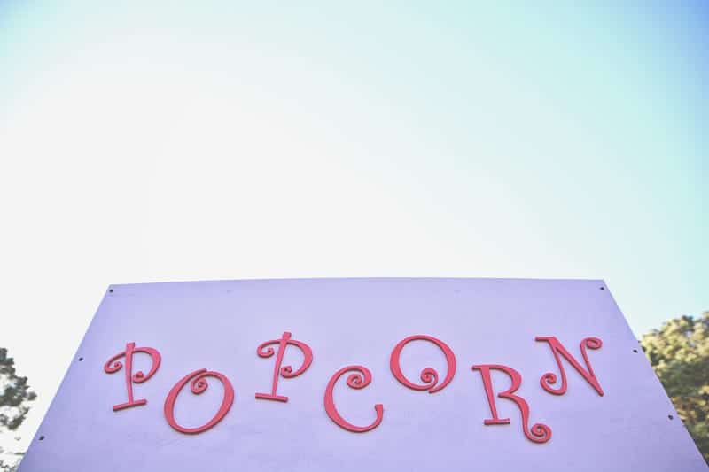 Carnival themed wedding backyard colourful sweet stand candy popcorn-18