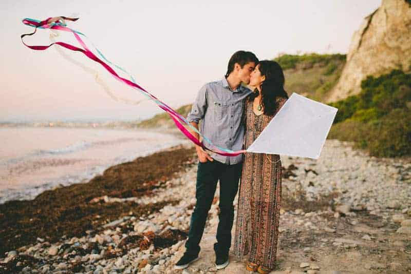 How to make your engagement shoot more personal - a colourful whimsical outdoor picnic engagement on the beach (21)