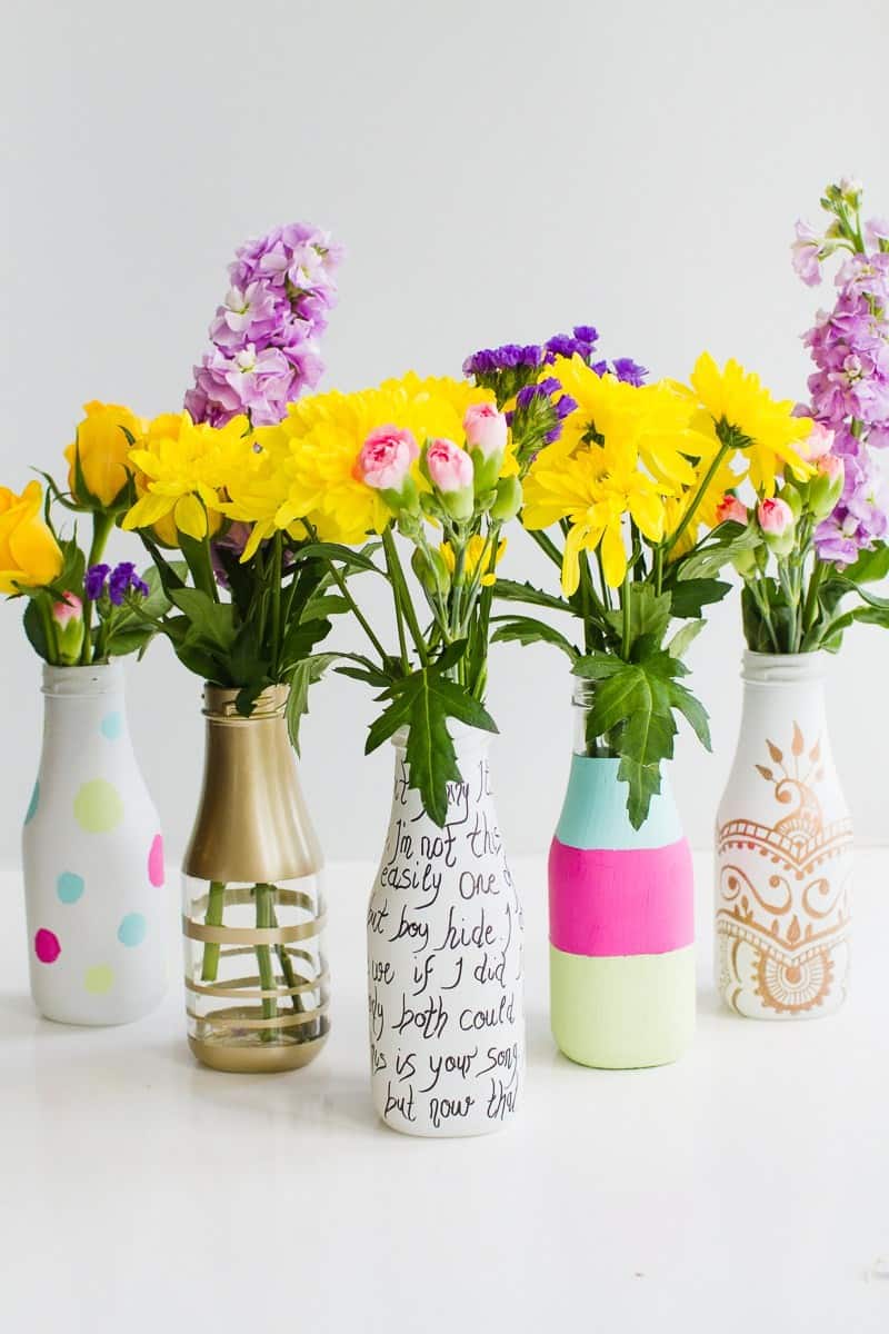 quick & easy wedding DIY's-5-ways-to-decorate-leftover-bottles-for-your-wedding-table-decor-with-paint-spray-paint-sharpies-2
