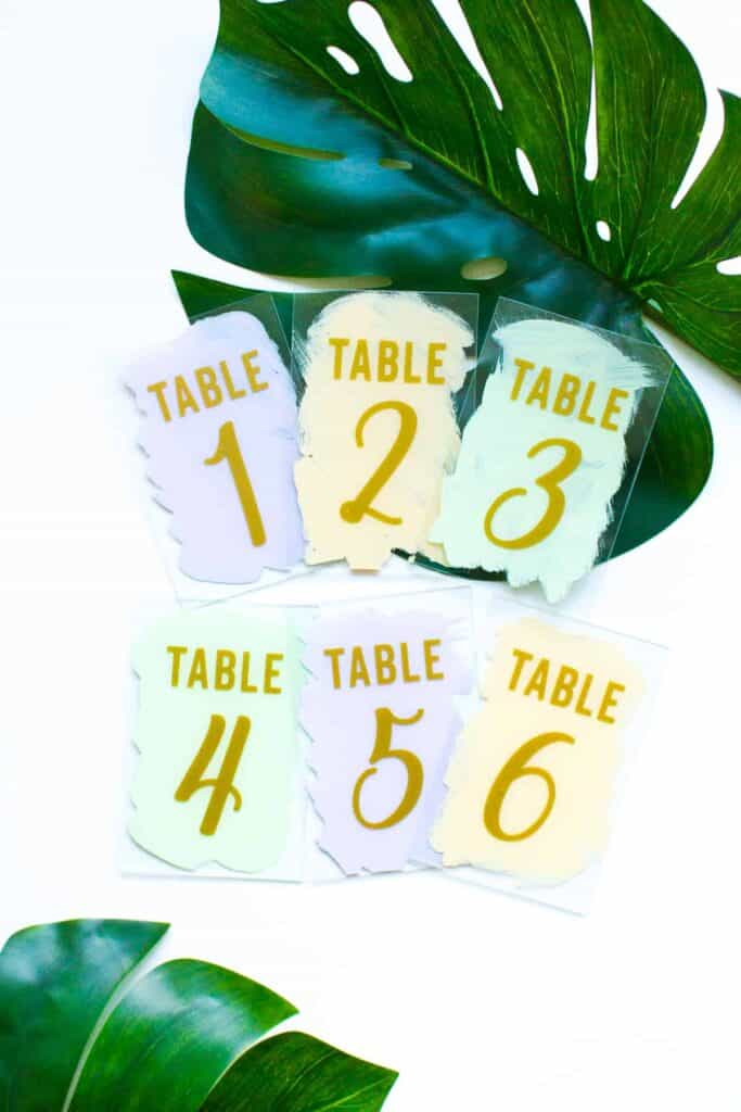 DIY THESE MODERN PASTEL PAINTED GLASS WEDDING TABLE NUMBERS