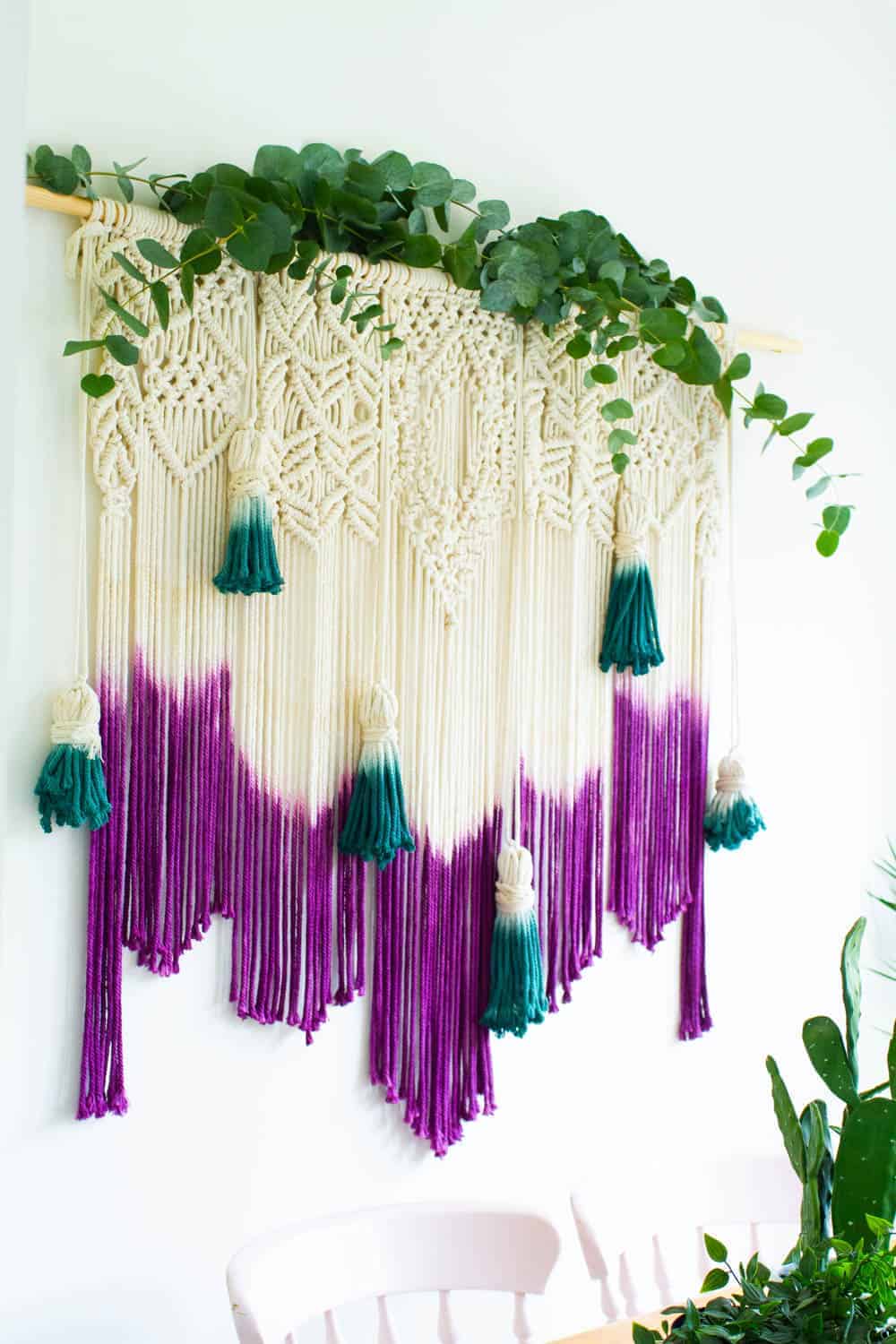 Learn how to make a DIY dyed macrame wall hanging backdrop with this tutorial, perfect for bohemian wedding decor