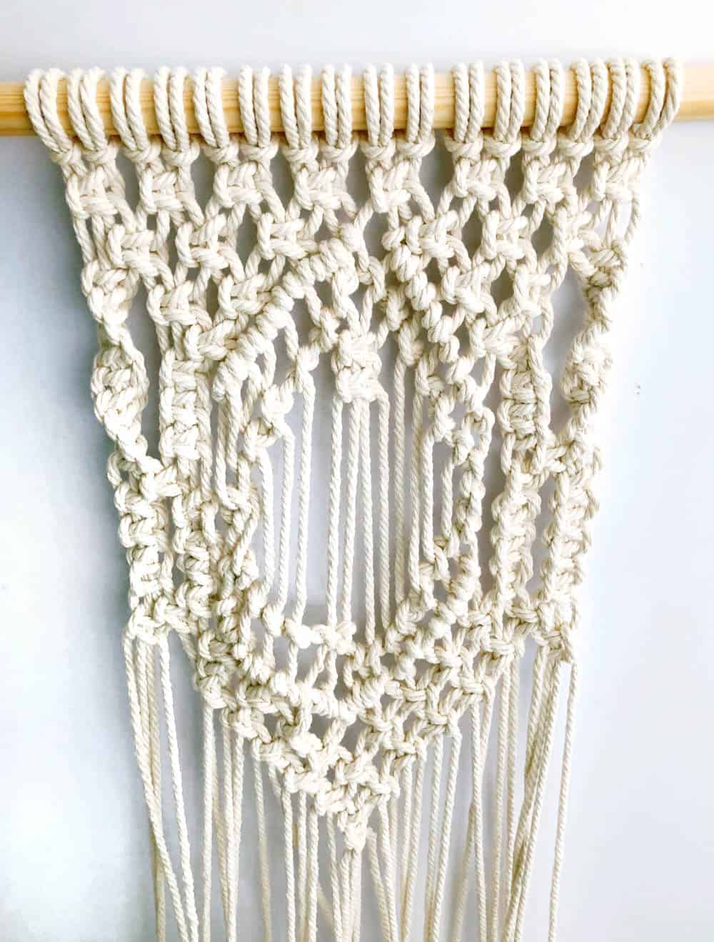 Learn how to make a DIY dyed macrame wall hanging backdrop with this tutorial, perfect for bohemian wedding decor Rit Dye