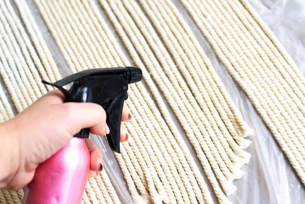 Learn how to make a DIY dyed macrame wall hanging backdrop with this tutorial, perfect for bohemian wedding decor Rit Dye