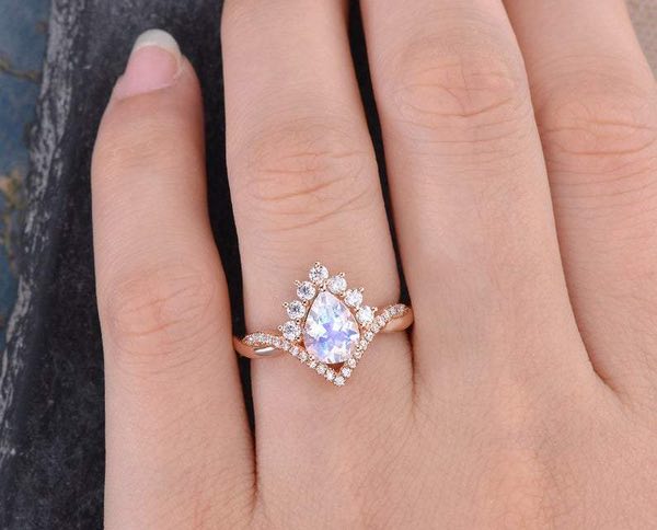 Pear cut moonstone and moissanite engagement ring