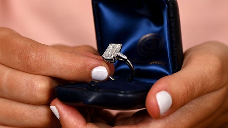 Customer Holding a vintage Emerald-Cut Diamond Engagement Ring