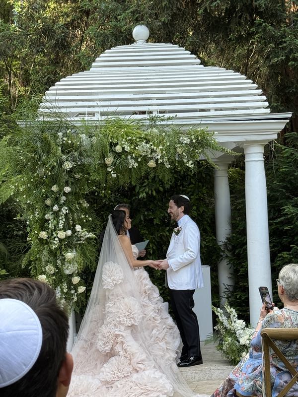 The beautiul bride Christina Teenz Tan and husband Ron Danziger during their wedding ceremony at the Hotel Bel Air