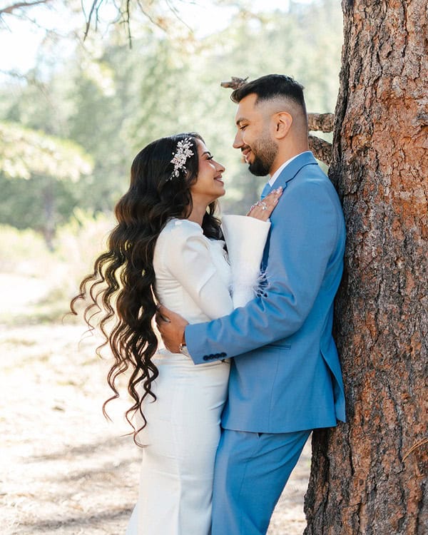 groom and bride leaning on a tree at Mount Charleston wedding styled shoot