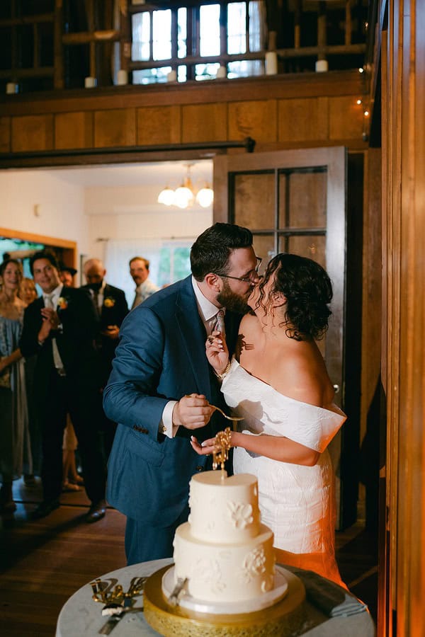bride and groom cutting the cake at a Lakeside Wedding at Valhalla Tahoe 