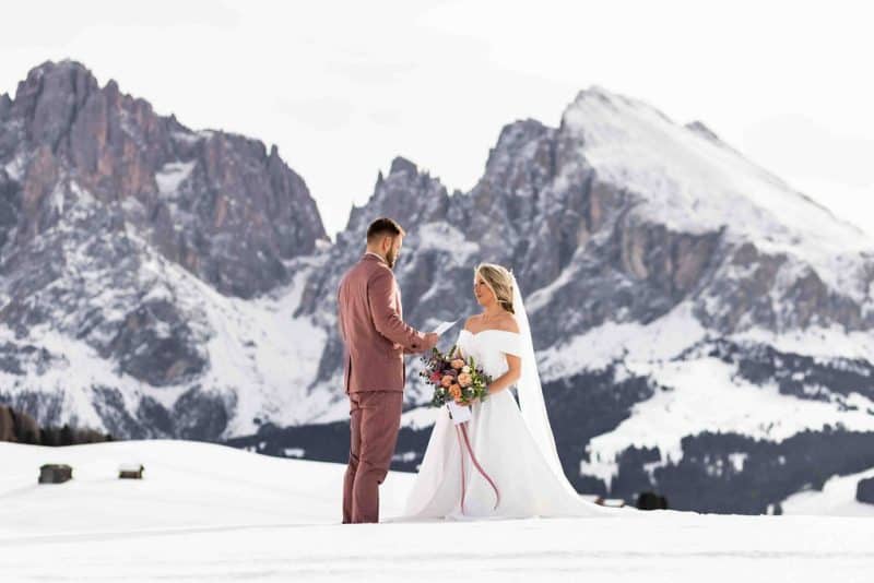 Helena & Keio's Dreamy Winter Vow Renewal In Italy: Snow, Pizza, And A Love Story 10 Years In The Making vow renewal photo shoot in dolomites in italy