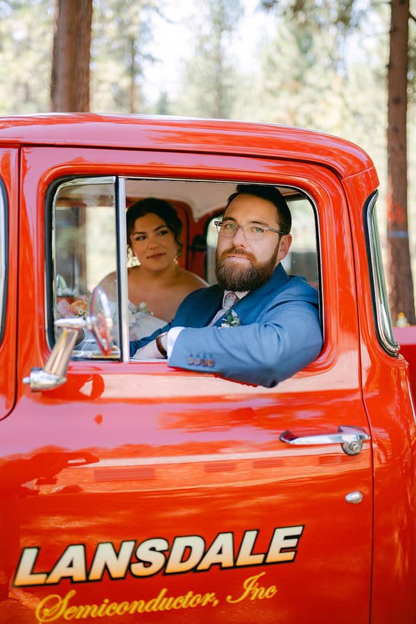 groom and bride inside a red car at their Lakeside Wedding at Valhalla Tahoe 