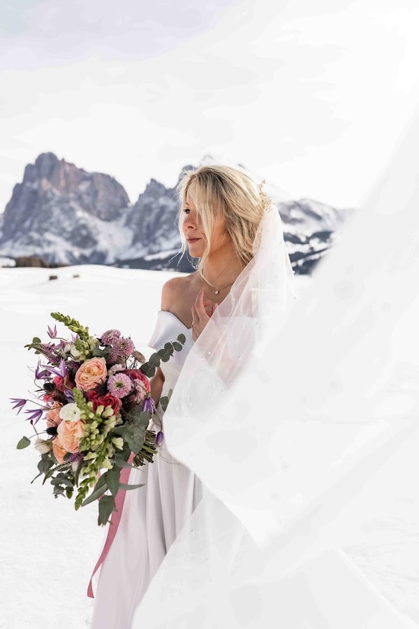 Helena & Keio's Dreamy Winter Vow Renewal In Italy: Snow, Pizza, And A Love Story 10 Years In The Making beautiful vow renewal in dolomites in italy