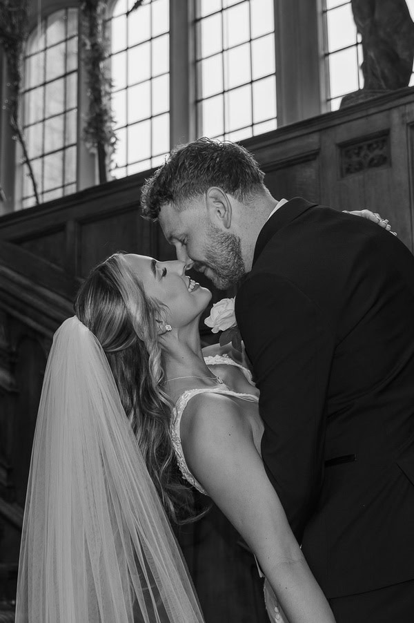 Lucy & Lewis's Romantic Bovey Castle Elopement (Plus Tips For Planning Your Own!) groom kissing bride at castle elopement