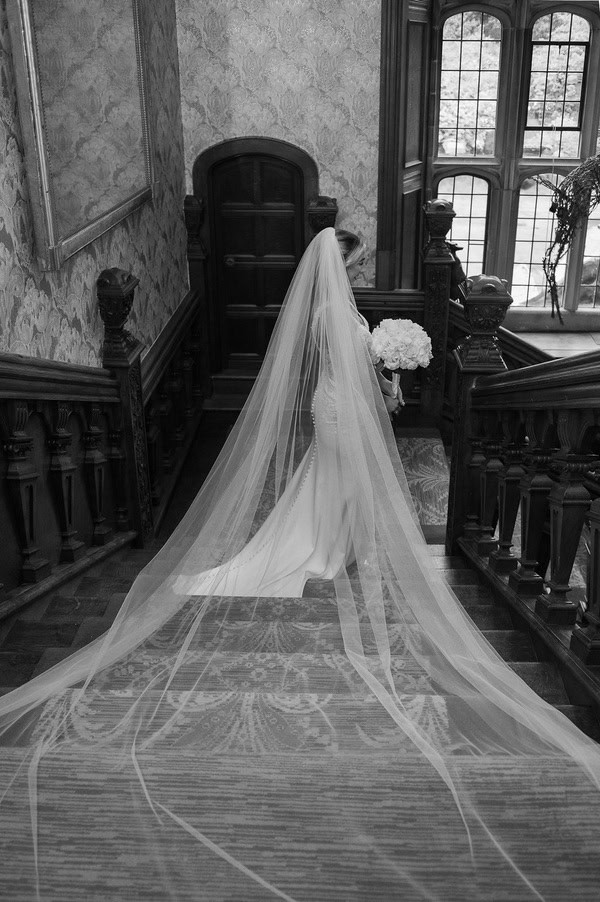 Lucy & Lewis's Romantic Bovey Castle Elopement (Plus Tips For Planning Your Own!) bride going down the stairs at a castle elopement
