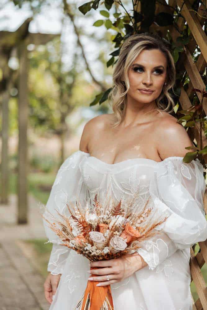 bride with flowers at one of the top wedding venues in york