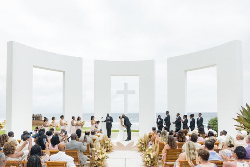 groom kisses bride ceremony at Celebration at One of Mexico Top Destination Wedding Resorts