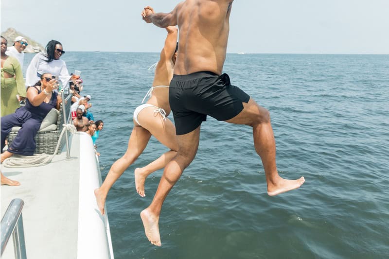 groom and bride jumping off yacht