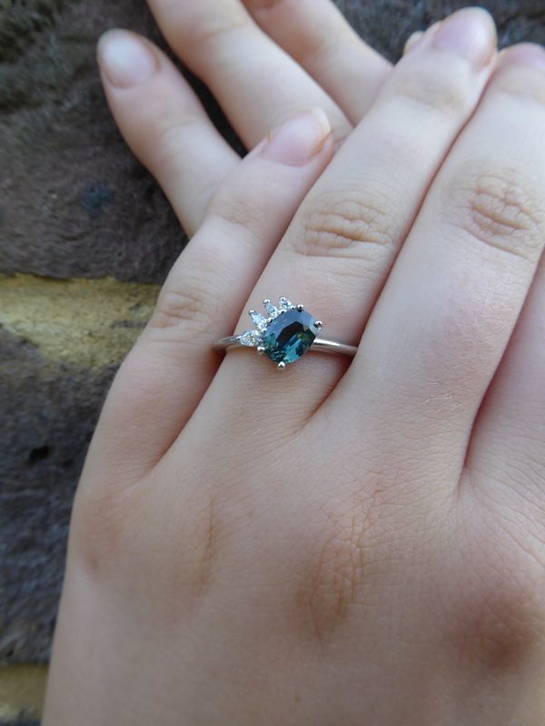 Teal Sapphire and diamonds Selene engagement ring on hand