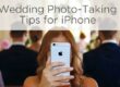 woman wedding guest taking photos with her iphone