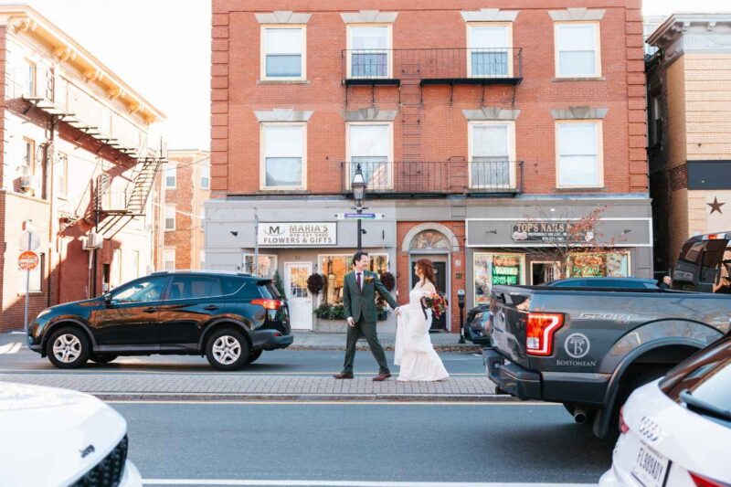 bride and groom walking to their wedding venue in massachusetts